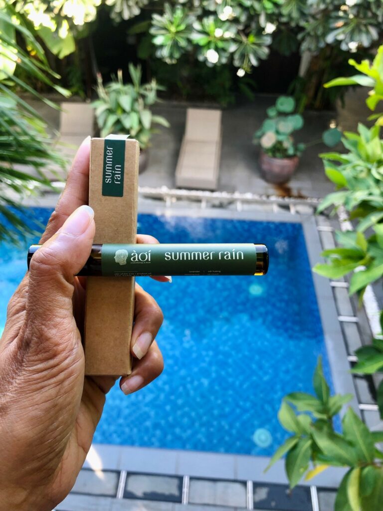 Summer rain essential oil roll on from In the mood Saigon in front of a hotel swimming pool