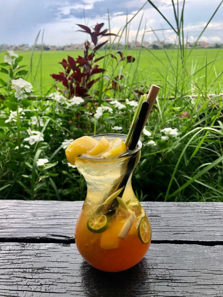 Beautiful and delicious kumquat peach tea by rice fileds on a swing in Hoi An, Vietnam by Don't tell my sisters